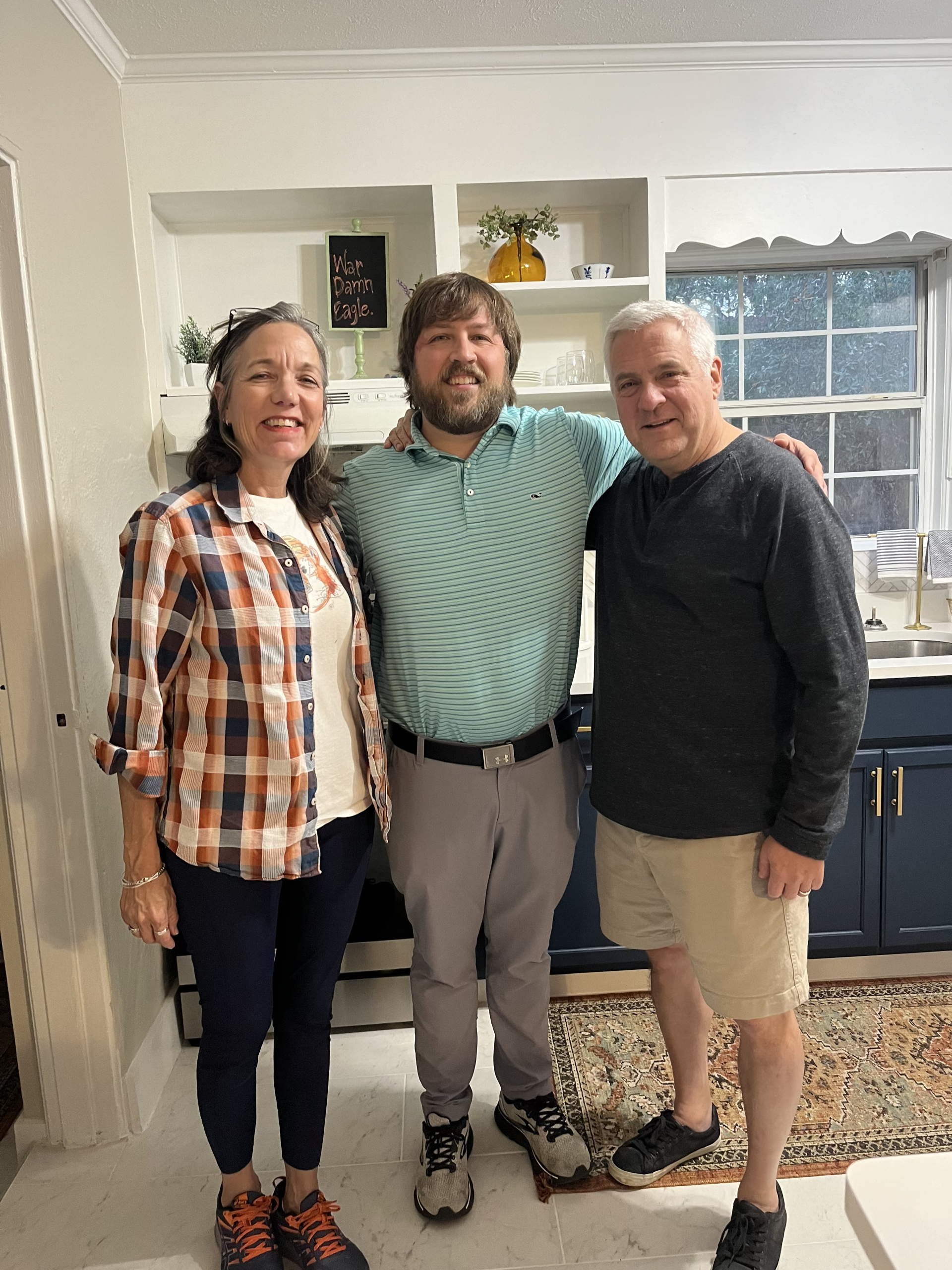 Happy Hayley Real Estate clients in their new kitchen